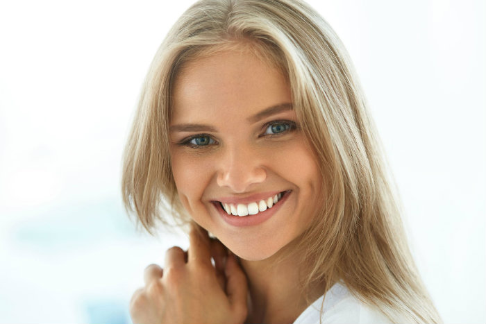 cute women with white teeth waterpik