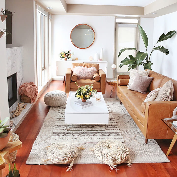 cozy living room with set of hand-woven tassel baskets,modern leather sofa and cushions