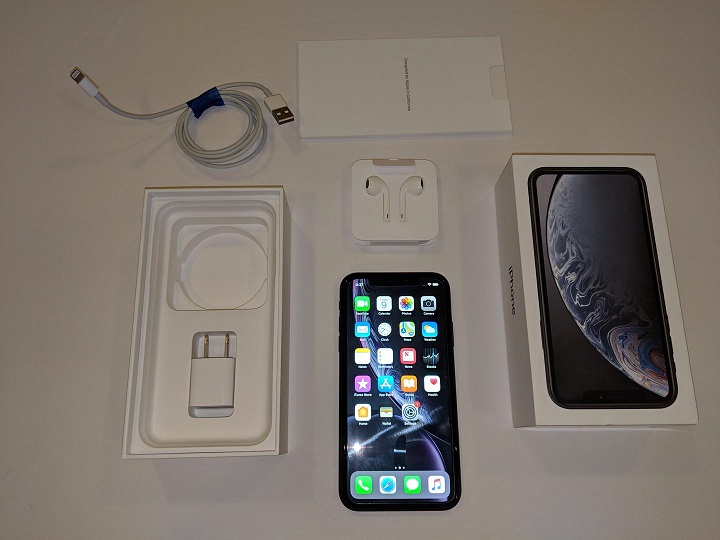 refurbished iphone with charger and cable unpacked from the box