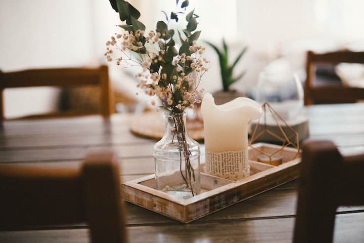 Fresh greenery and candle kitchen table centerpiece