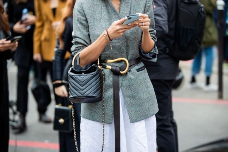 a lady wearing a black leather belt